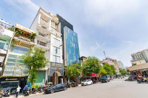 a street in a city with buildings and cars at Nicecy NganHa Hotel in Ho Chi Minh City +54 photos