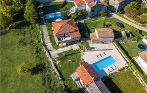 an overhead view of a house with a swimming pool at Villa Mendula in Potpićan