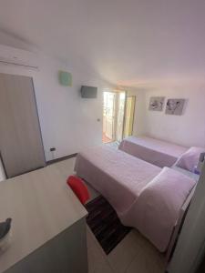 Postel nebo postele na pokoji v ubytování B&B Le Terrazze