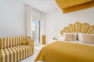 Cama ou camas em um quarto em Croco Mykonos