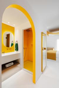 Cama ou camas em um quarto em Croco Mykonos