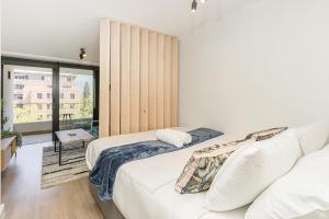Rúm í herbergi á Newlands Peak Living Apartments