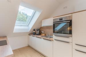 Kuchyň nebo kuchyňský kout v ubytování Modernes Apartment in Langenbach bei München, nahe Flughafen München