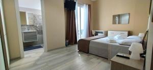 Postel nebo postele na pokoji v ubytování Giliberto Rooms
