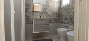 Koupelna v ubytování Giliberto Rooms