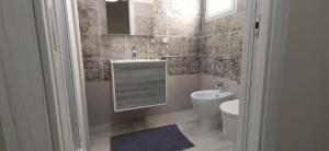 Koupelna v ubytování Giliberto Rooms