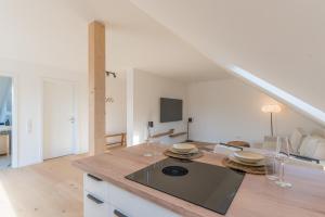 Kuchyň nebo kuchyňský kout v ubytování Modernes Apartment in Langenbach bei München, nahe Flughafen München