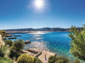 a view of a body of water with the sun in the sky at Holiday Home Boni in Rab