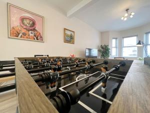a room with a group of wooden figurines in it at Luxury Central Windsor 5 Bed Home, Parking, Private Garden - Windsor Castle View, Legoland, Ascot, Heathrow Airport in Windsor