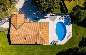 an overhead view of a house with a pool at Villa Miana in Orbanići