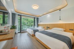 เตียงในห้องที่ 安吉季意民宿 Jiyi Boutique Homestay, Anji, Huzhou