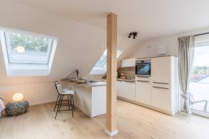 Kuchyň nebo kuchyňský kout v ubytování Modernes Apartment in Langenbach bei München, nahe Flughafen München