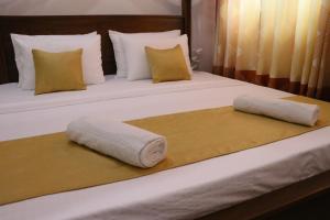 Ένα ή περισσότερα κρεβάτια σε δωμάτιο στο Sheru Guest