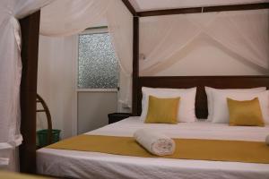 Ένα ή περισσότερα κρεβάτια σε δωμάτιο στο Sheru Guest