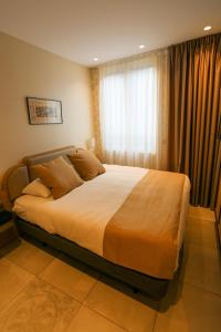 Postel nebo postele na pokoji v ubytování Splendid Hôtel & Spa