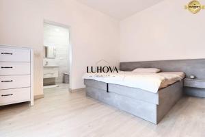 Posteľ alebo postele v izbe v ubytovaní Luxusný rodinný dom v Trenčíne