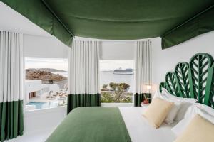 Cama ou camas em um quarto em Croco Mykonos