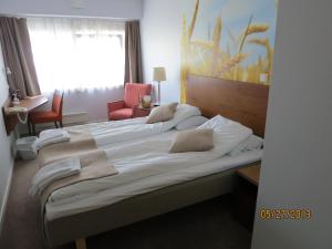 Postel nebo postele na pokoji v ubytování Kysthotellet Rørvik + 5 fotografií