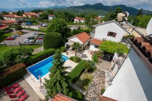 an aerial view of a house with a swimming pool at Apartments Dorijan with Pool in Matulji