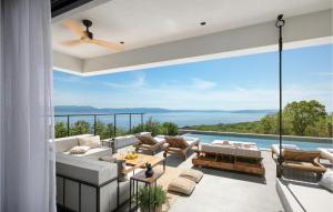 a patio with a view of the ocean from a house at Villa The View in Sveta Marina