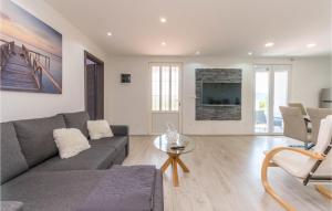 a living room with a couch and a table at Lovely Home In Stankovci With Wifi in Stankovci