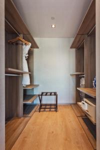a room with wooden shelves and a bench in it at Fraser Place Antasya Istanbul in Istanbul