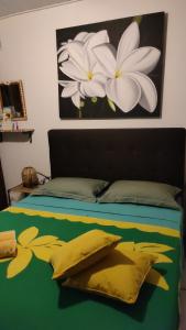 Letto o letti in una camera di Fare D'hôtes Tutehau