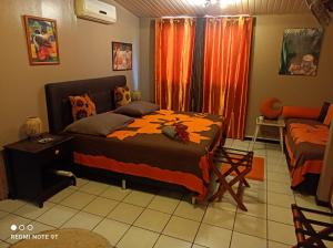 Letto o letti in una camera di Fare D'hôtes Tutehau