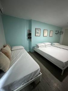 Voodi või voodid majutusasutuse Studio w projector Wifi Netflix and pool access in ADB Tower Ortigas CBD toas