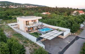 an aerial view of a house with a swimming pool at Villa Manali in Jadranovo