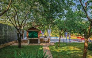 a park with a playground with a play structure at Three-Bedroom Holiday Home In Prolozac Donji in Donji Proložac +27 photos