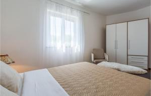 Postel nebo postele na pokoji v ubytování Holiday Home Vrecari 27