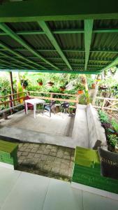 a patio with a table and a table and chairs at Finca los Martinez - Tamesis - Vereda San Isidro in Támesis +6 photos