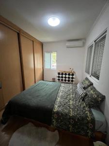 Postel nebo postele na pokoji v ubytování Girassol Luanda