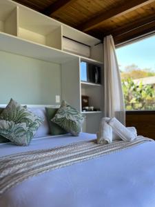 Ένα ή περισσότερα κρεβάτια σε δωμάτιο στο Pousada Morada Porto Verde +65 φωτογραφίες