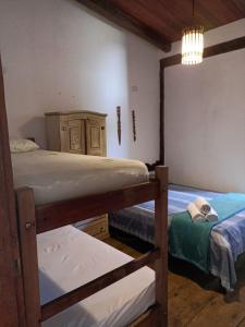 Postel nebo postele na pokoji v ubytování Pousada Portal da Mucugê