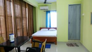 Fotografie z fotogalerie ubytování Easy Stay Eranhipalam v destinaci Kóžikkót