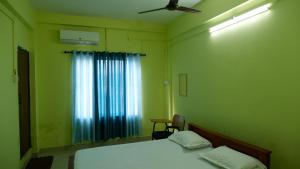 Fotografie z fotogalerie ubytování Easy Stay Eranhipalam v destinaci Kóžikkót