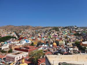 an aerial view of a city with buildings at Casa Madrigal in Guanajuato