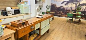 a kitchen with a wooden counter top in a room at Napoli Tree - Lungomare in Naples