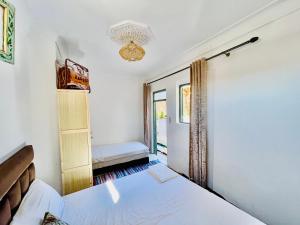 Postel nebo postele na pokoji v ubytování Riad Dar Lokman