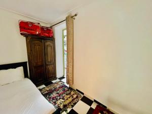 Postel nebo postele na pokoji v ubytování Riad Dar Lokman