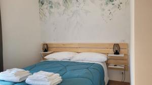 Postel nebo postele na pokoji v ubytování B&B 3Rome Salaria