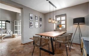 a dining room with a wooden table and chairs at Villa Maria Selina in Selina