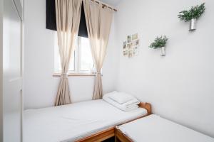 Posteľ alebo postele v izbe v ubytovaní Master Corner Apartment