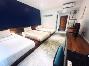 Postel nebo postele na pokoji v ubytování TATATA Koh Tao