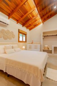 Postel nebo postele na pokoji v ubytování Amarelo Casa em Bonito + 28 fotografií