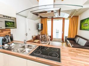 a kitchen with a sink and a stove top oven at Apartment Emma-7 by Interhome in Dürnberg
