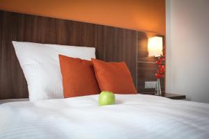Postel nebo postele na pokoji v ubytování Hotel Rosenhof Garni