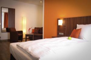 Postel nebo postele na pokoji v ubytování Hotel Rosenhof Garni